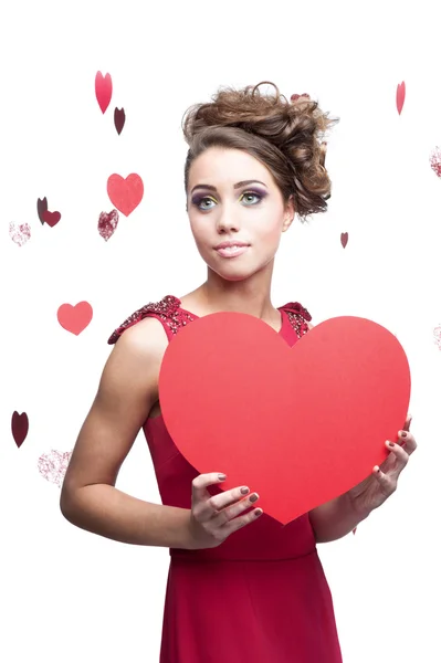 Young cheerful woman holding red paper heart — Stock Photo, Image