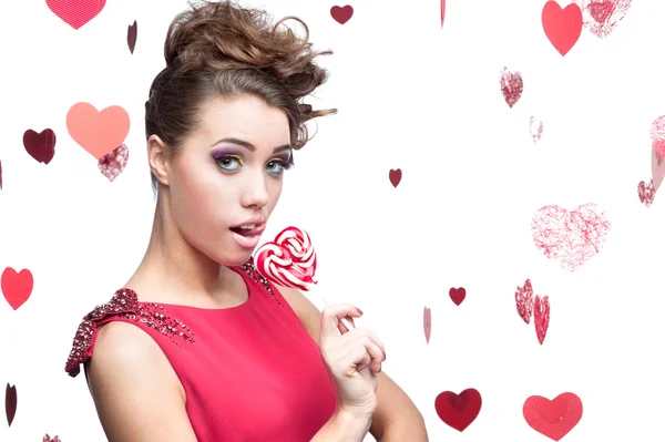 Brunette woman holding lollipop — Stock Photo, Image