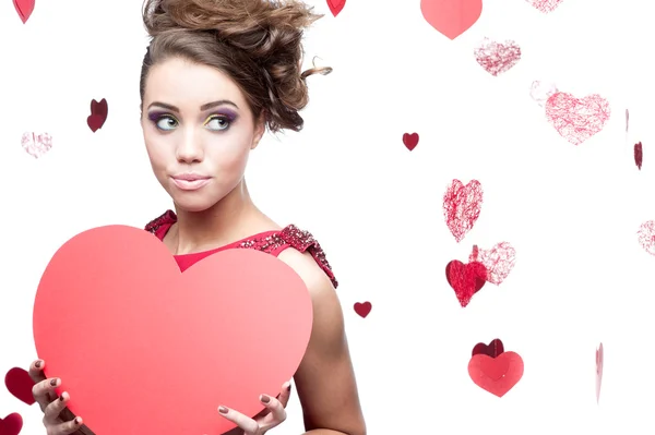 Young cheerful woman holding red paper heart — Stock Photo, Image