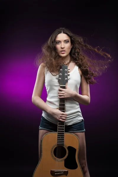 Sexy girl holding guitar — Stock Photo, Image