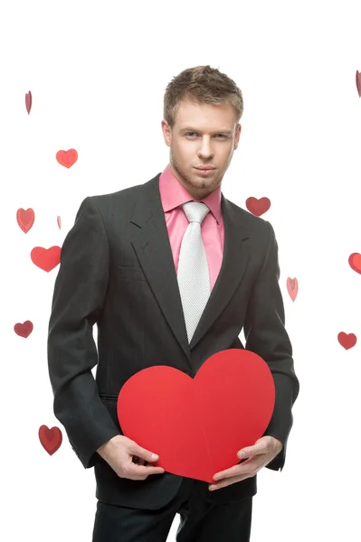 Businessman holding big red heart — Stock Photo, Image