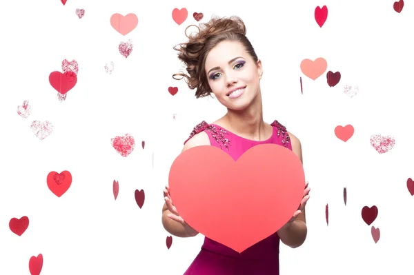 Brunette woman holding big red paper heart — Stock Photo, Image