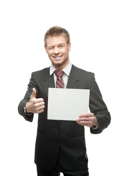 Cheerful winking businessman holding sign Royalty Free Stock Images