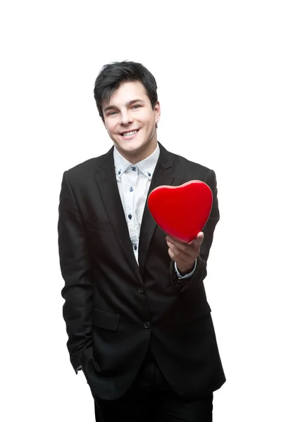 Young businessman holding heart — Stock Photo, Image