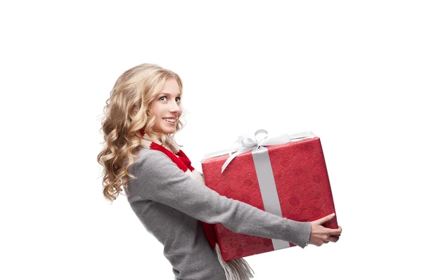 Young smiling woman holding christmas gift — Stock Photo, Image