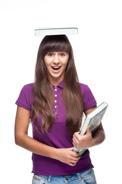 Ragazza con libro sulla testa — Foto Stock