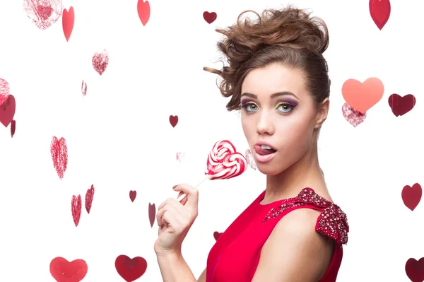 Brunette woman holding lollipop — Stock Photo, Image