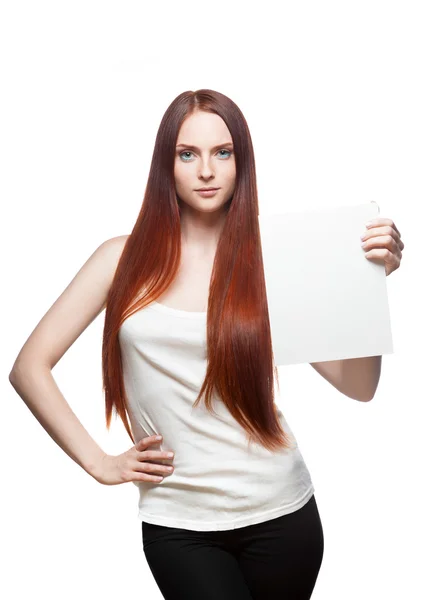 Beautiful red haired girl holding sign — Stock Photo, Image