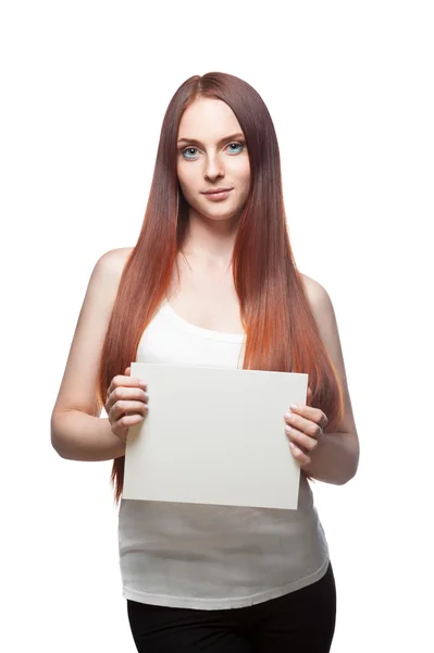 Beautiful red haired girl holding sign — Stock Photo, Image