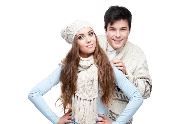 Young smiling couple in winter clothing embracing — Stock Photo, Image