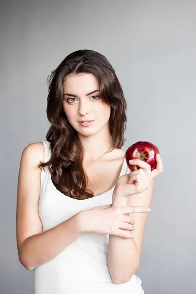 Girl holding red apple — Stock Photo, Image