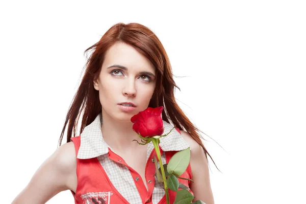 Attractive thoughtful girl holding red rose — Stock Photo, Image