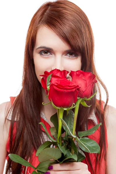 Atractiva chica sosteniendo rosas rojas —  Fotos de Stock
