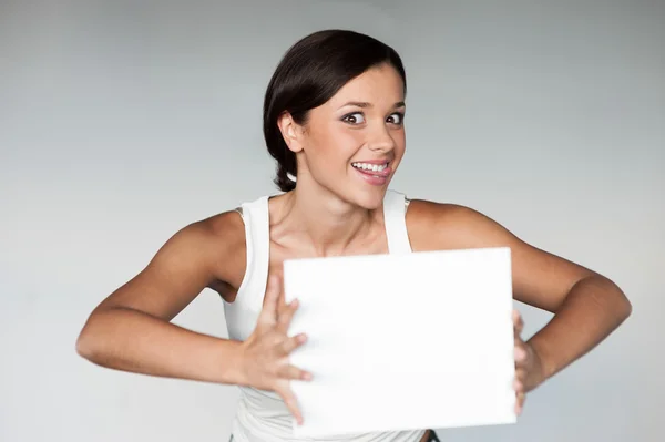 Cheerful girl holding sign — Stock Photo, Image