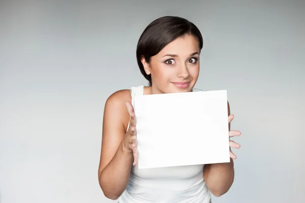 Cheerful girl holding sign — Stock Photo, Image
