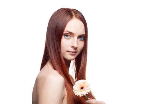 Beautiful red haired girl holding flower — Stock Photo, Image