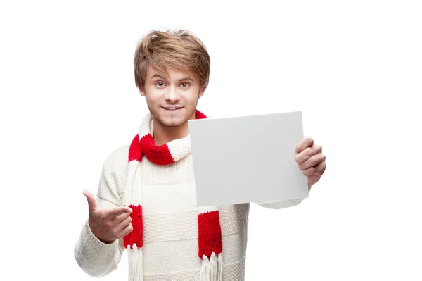 Young funny man pointing at sign — Stock Photo, Image