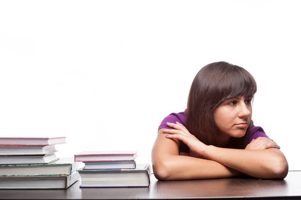 Chica aburrida sentada con libros — Foto de Stock