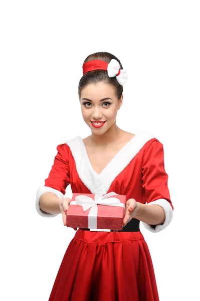 Cheerful retro girl holding red gift — Stock Photo, Image