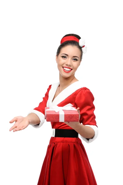 Cheerful retro girl holding red gift — Stock Photo, Image