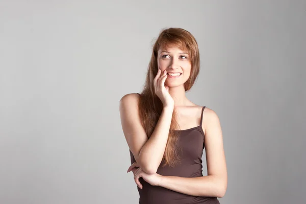 Cheerful casual girl on gray — Stock Photo, Image