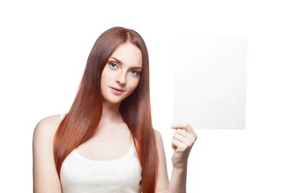 Beautiful red haired girl holding sign — Stock Photo, Image