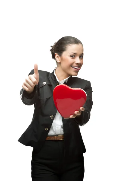 Joven mujer de negocios alegre sosteniendo el corazón rojo — Foto de Stock