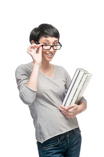 Cheerful casual woman holding books — Stock Photo, Image