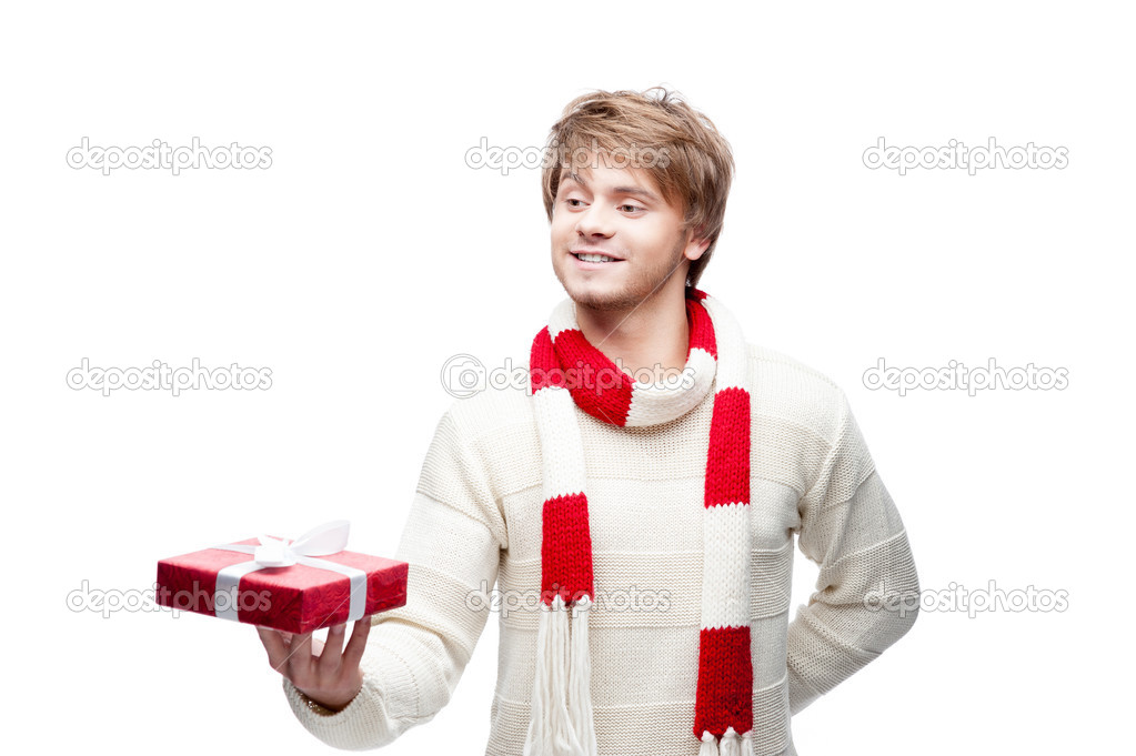 young smiling man holding christmas gift