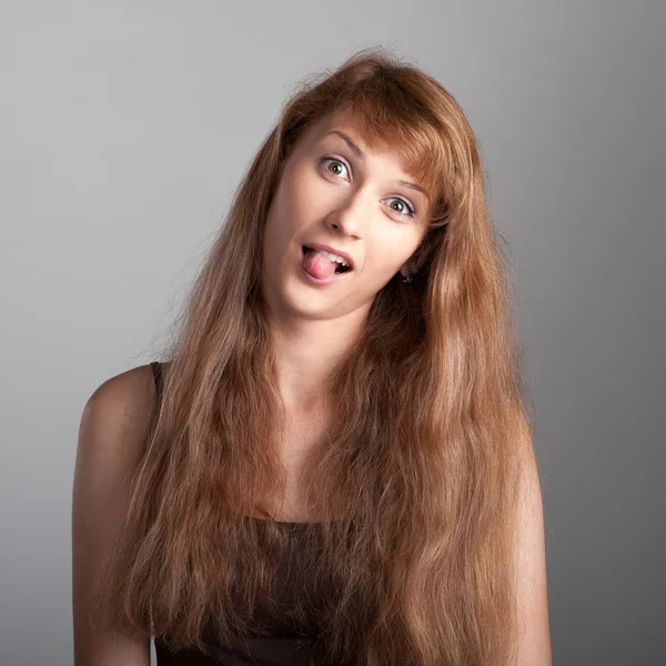 Cheerful casual girl on gray — Stock Photo, Image