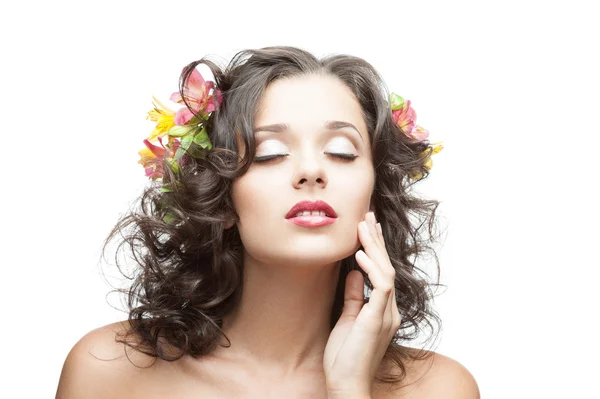 Young woman with flower in hair — Stock Photo, Image