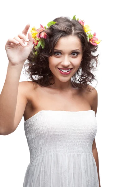 Smiling young woman with flower in hair Royalty Free Stock Photos