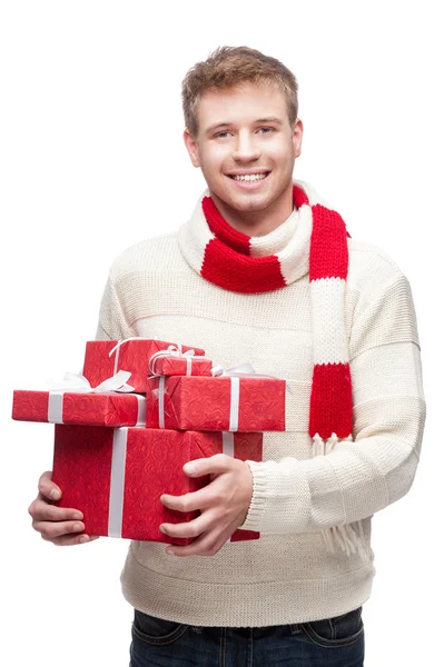 Attractive young man holding red gift — Stock Photo, Image