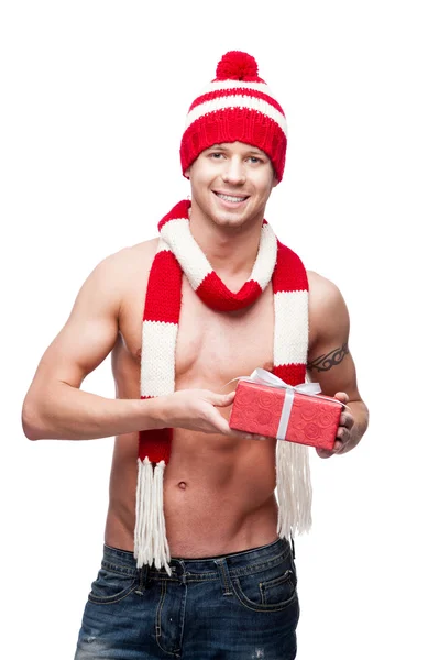 Sexy macho drží červené dárkové — Stock fotografie