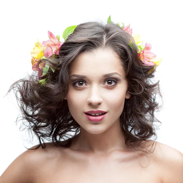 Young woman with flower in hair — Stock Photo, Image