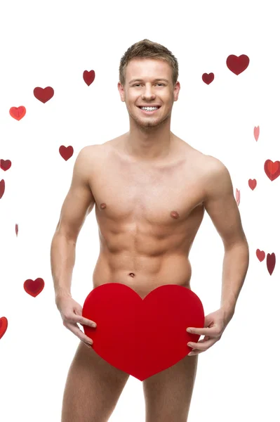 Funny naked man holding big red paper heart — Stock Photo, Image