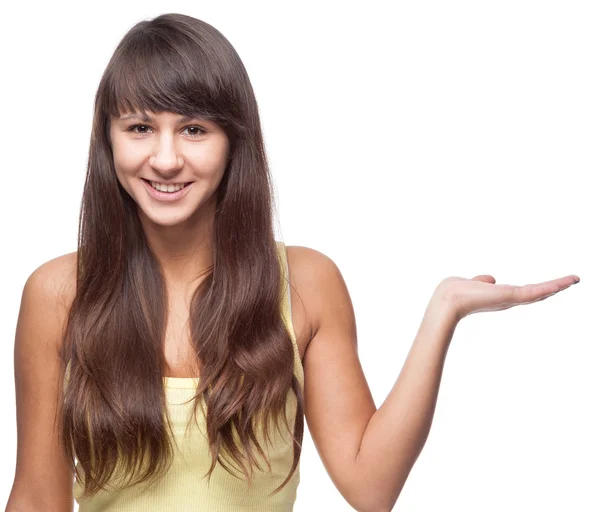 Chica apuntando al espacio vacío — Foto de Stock