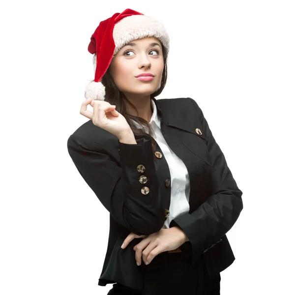 Young thoughtful businesswoman in santa hat standing isolated on — Stock Photo, Image