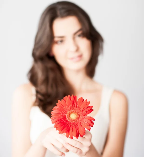 Beautiful girl with red flower — Stock Photo, Image