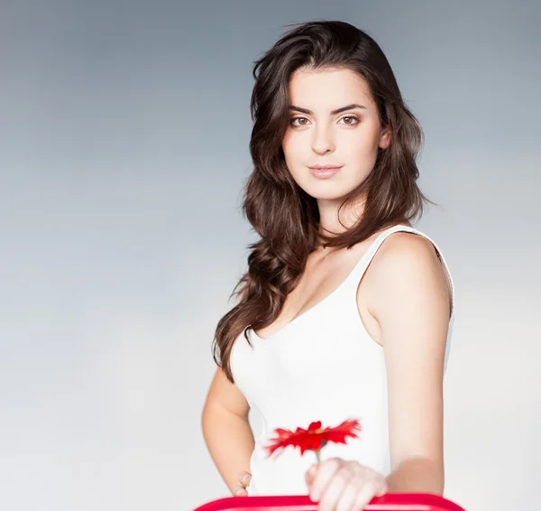 Beautiful girl with red flower — Stock Photo, Image