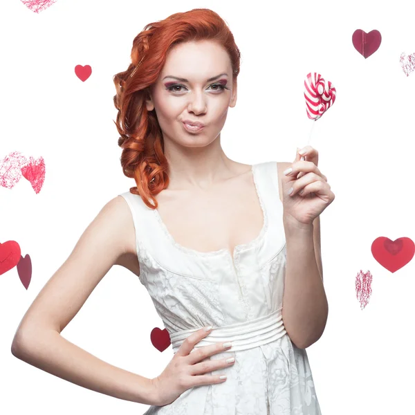 Red-haired woman holding lollipop — Stock Photo, Image