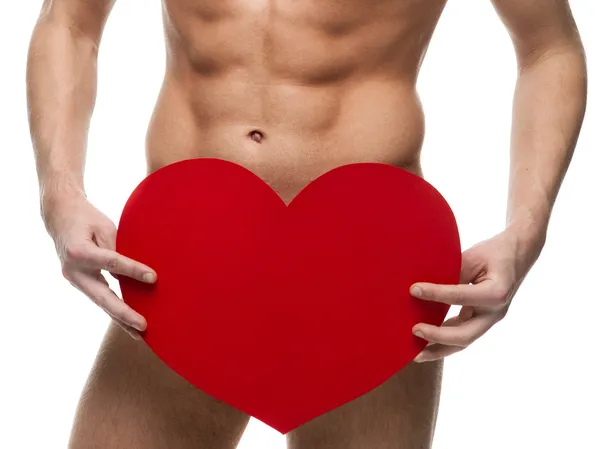 Naked man holding big red paper heart — Stock Photo, Image