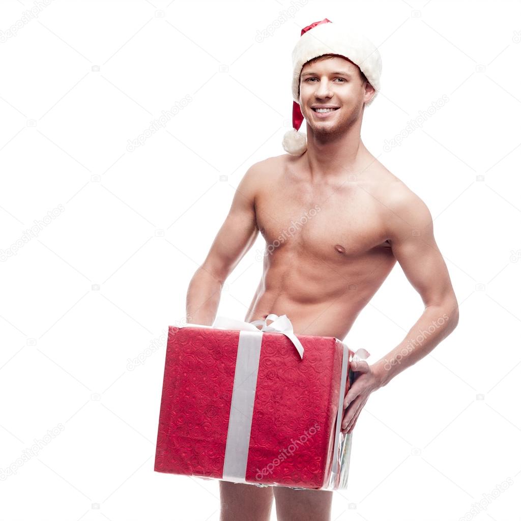 Muscular, Santa Claus With Gift Stock Image - Image of 