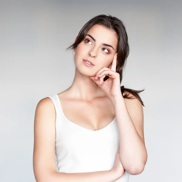 Attractive thoughtful girl looking away — Stock Photo, Image