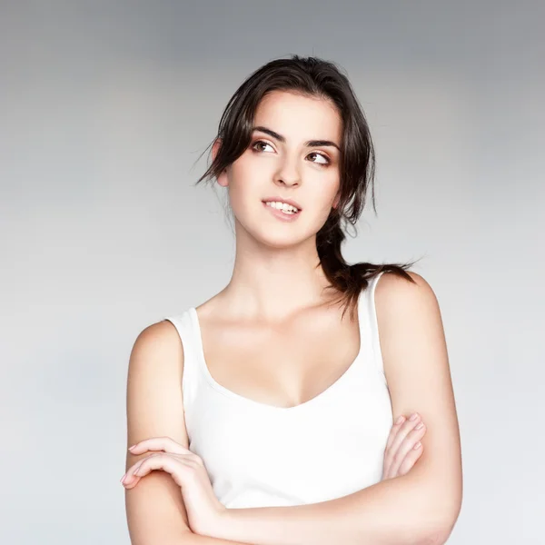 Casual brunette girl holding cell phone — Stock Photo, Image