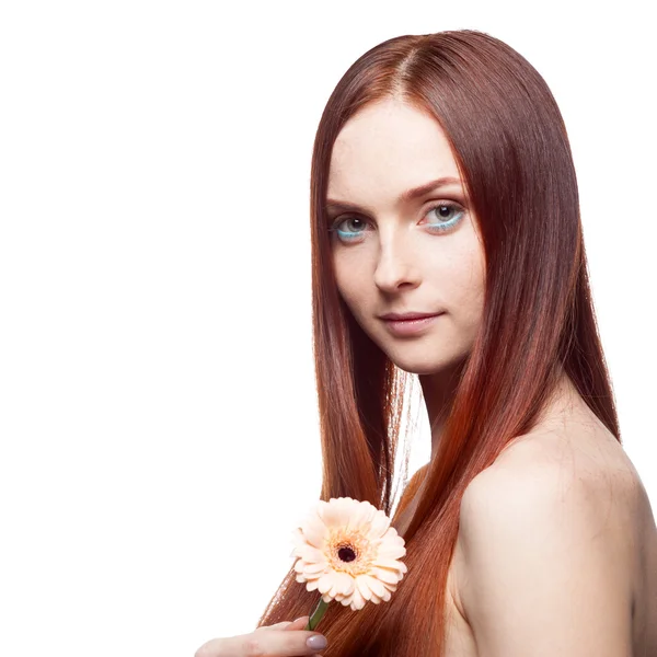 Beautiful red haired girl holding flower — Stock Photo, Image