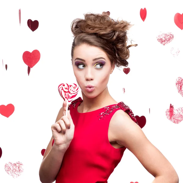 Brunette woman holding lollipop — Stock Photo, Image