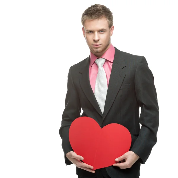 Businessman holding big red heart — Stock Photo, Image