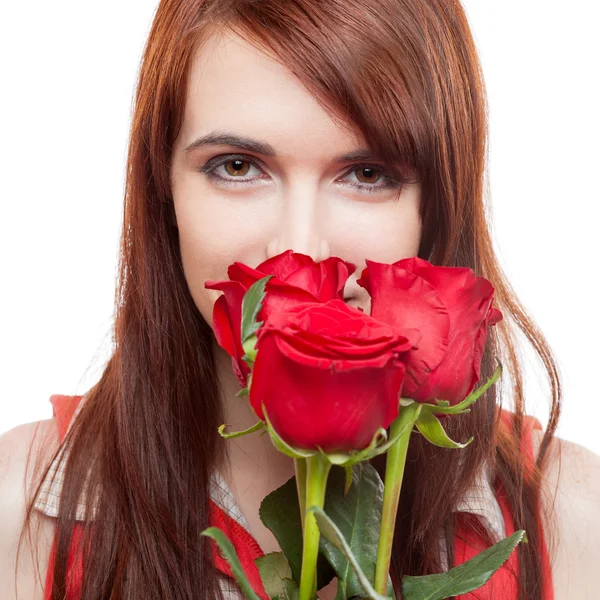 Atractiva chica sosteniendo rosas rojas —  Fotos de Stock