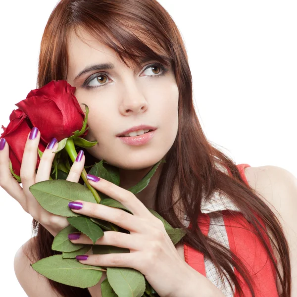 Attractive thoughtful girl holding red roses — Stock Photo, Image